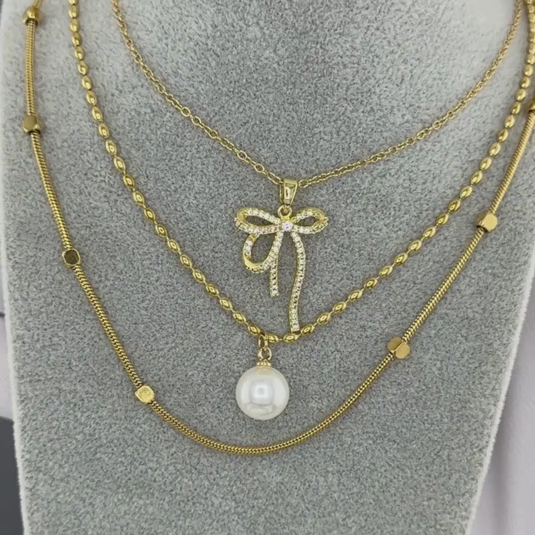 Gold bow necklace for women crafted in 18K gold plated steel with crystal accents by NOVAHERA.